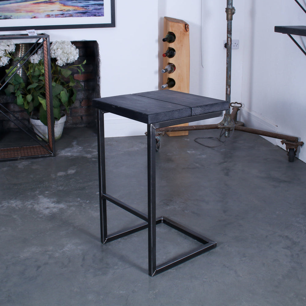Rustic solid oak garden bar stool with a thick seat and cantilever steel frame