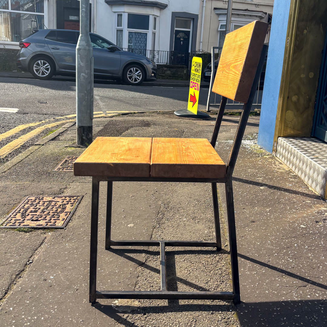 Rustic solid oak garden cube chair with a square seat and cantilever steel frame