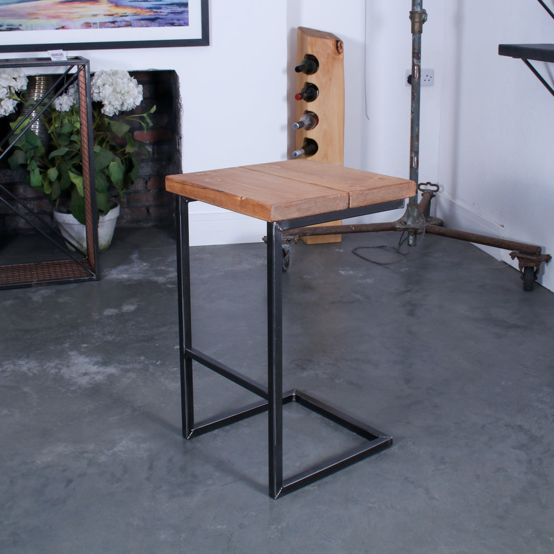 Rustic solid oak garden bar stool with a thick seat and cantilever steel frame