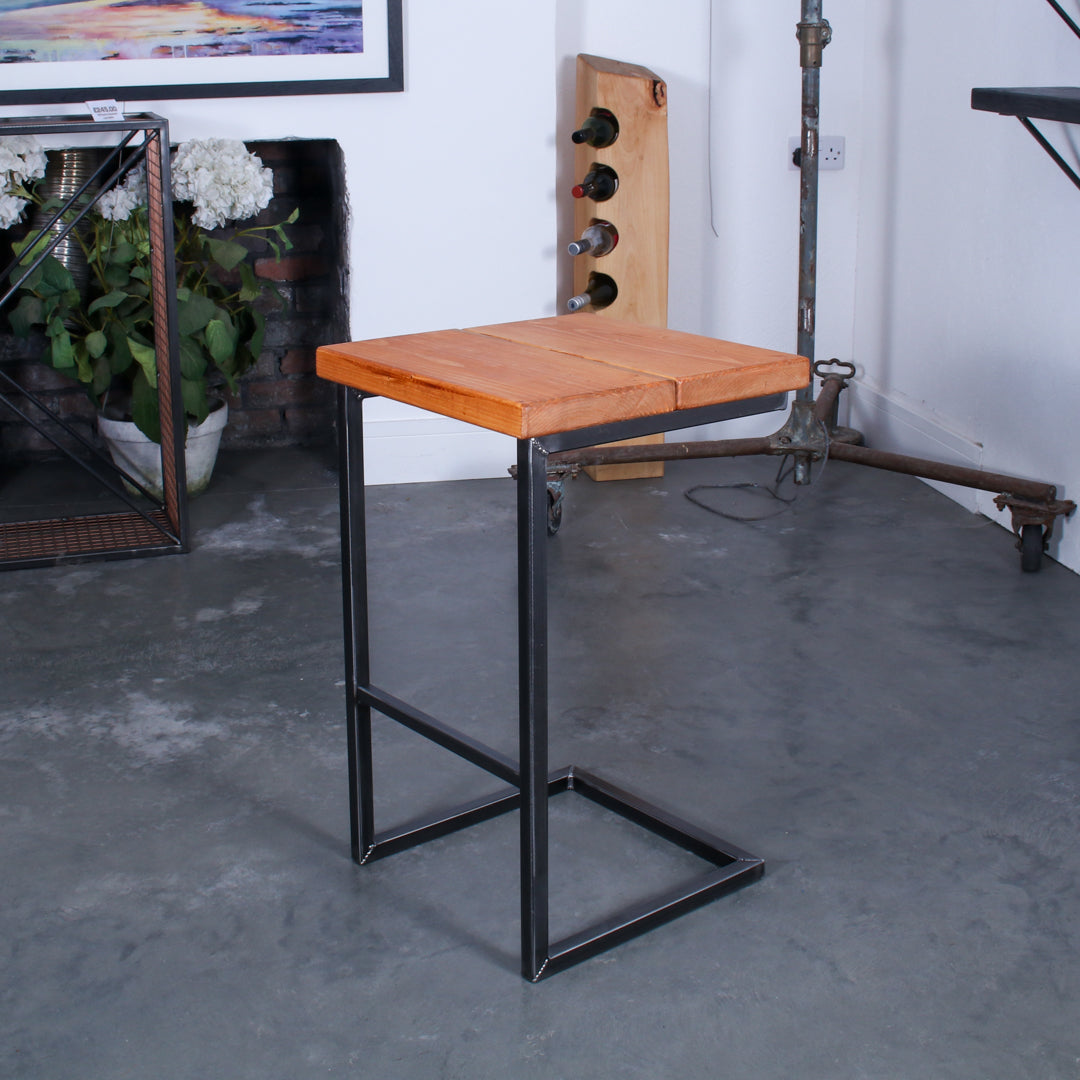 Rustic solid oak garden bar stool with a thick seat and cantilever steel frame