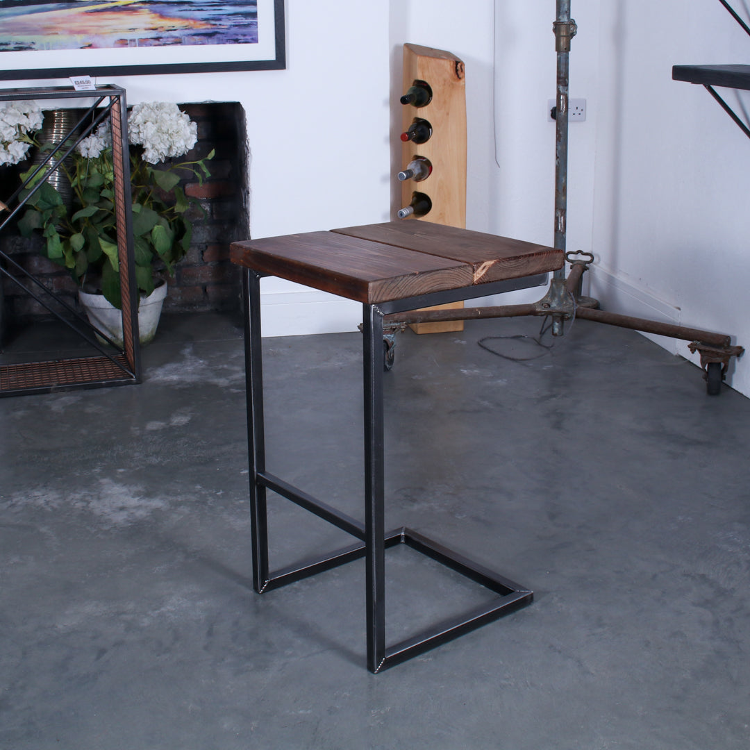 Rustic solid oak garden bar stool with a thick seat and cantilever steel frame